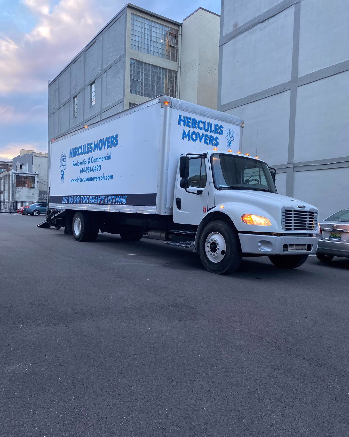 commercial movers truck parked in urban area