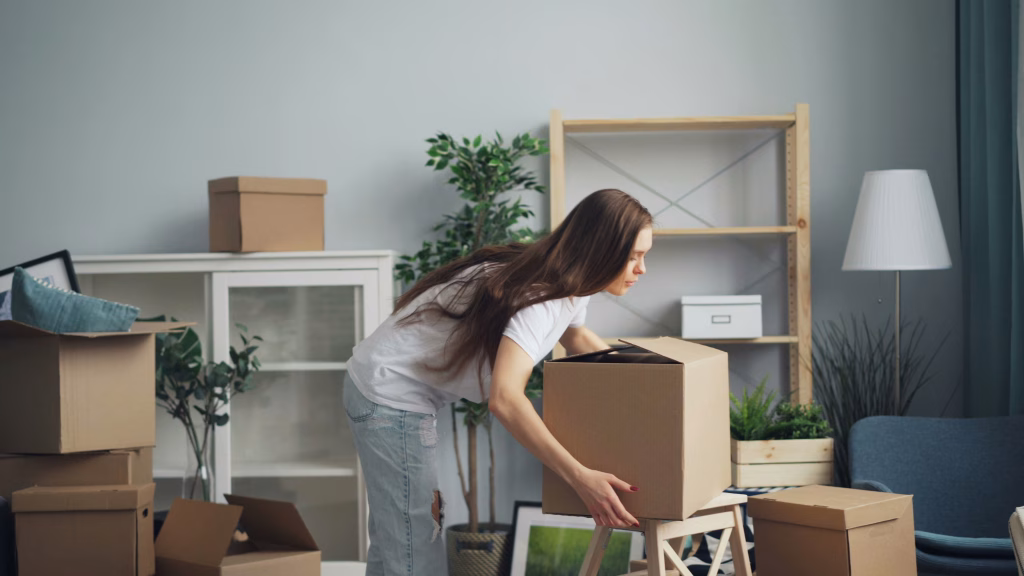 Woman packing boxes and following a moving timeline to move to a new house